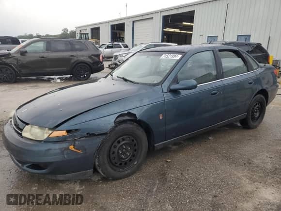 2002 Saturn LS with VIN 1G8JU54F72Y581967, listed as a Copart auction lot 74521994 with 215,018 mi miles and Salvage title. Bid and sale history available at DreamBid. Image 1.