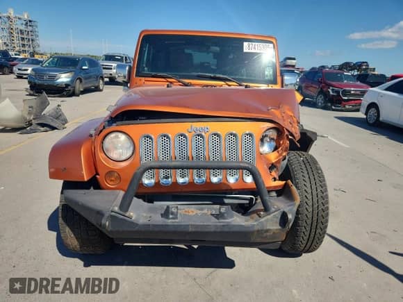 2011 Jeep Wrangler Sahara с VIN 1J4GA5D18BL576541, выставлен на аукционе Copart как лот 87415305 с пробегом 142 246 миль миль и Списание • Salvage title. История ставок и продаж доступна на DreamBid. Изображение 5.