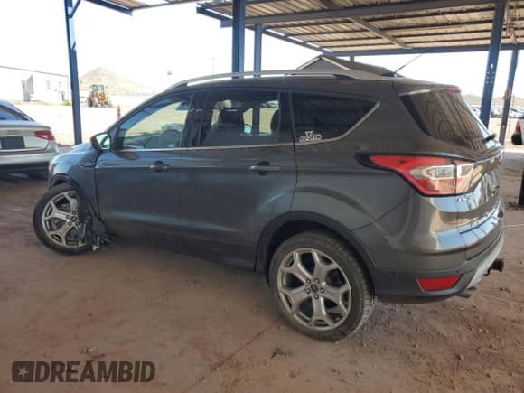 2017 Ford Escape Titanium with VIN 1FMCU9J96HUD28588, listed as a Copart auction lot 80167355 with 94,347 mi miles and Salvage title. Bid and sale history available at DreamBid. Image 2.