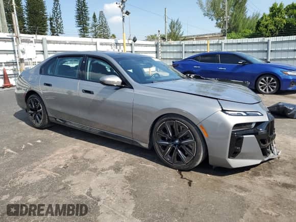 2023 BMW 7 Series 740i with VIN WBA23EH07PCM61560, listed as a Copart auction lot 69492185 with Not provided miles and Salvage title. Bid and sale history available at DreamBid. Image 4.