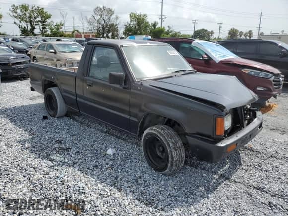 1988 Dodge RAM with VIN JB7FL24D7JP103516, listed as a Copart auction lot 59259515 with 210,940 mi miles and Salvage title. Bid and sale history available at DreamBid. Image 4.