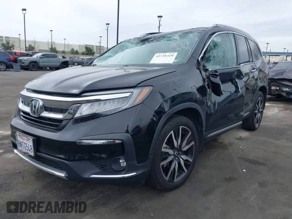 2020 Honda Pilot Touring 7-Passenger z VIN 5FNYF5H62LB009506, wystawiony jako IAAI lot #41735329 z przebiegiem 54 373 mil mil oraz . Historia ofert i sprzedaży dostępna na DreamBid. Obrazek 2.