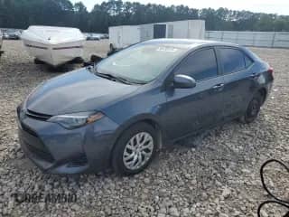 2019 Toyota Corolla LE z VIN 5YFBURHE5KP869865, wystawiony jako Copart lot #90138415 z przebiegiem 156 906 mil mil oraz Czysty tytuł • Clean title. Historia ofert i sprzedaży dostępna na DreamBid. Obrazek 1.