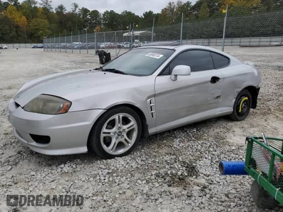 2005 Hyundai Tiburon GS with VIN KMHHM65D05U184230, listed as a Copart auction lot 80068374 with 135,076 mi miles and Salvage title. Bid and sale history available at DreamBid. Image 1.