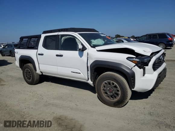 2024 Toyota Tacoma SR5 with VIN 3TMLB5JN4RM050957, listed as a Copart auction lot 71130595 with 1,873 mi miles and Salvage title. Bid and sale history available at DreamBid. Image 4.