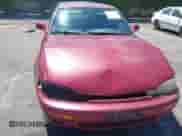 1995 Toyota Camry LE z VIN JT2SK12E6S0298227, wystawiony jako IAAI lot #42788533 z przebiegiem 112 709 mil mil oraz . Historia ofert i sprzedaży dostępna na DreamBid. Obrazek 6.