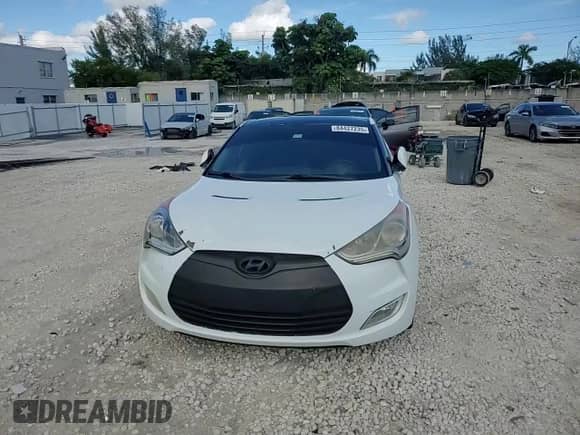 2014 Hyundai Veloster z VIN KMHTC6AD4EU194875, wystawiony jako Copart lot #84427235 z przebiegiem 127 813 mil mil oraz Szkoda całkowita • Salvage title. Historia ofert i sprzedaży dostępna na DreamBid. Obrazek 13.