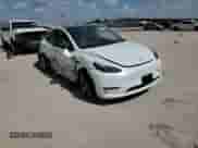 2024 Tesla Model Y with VIN 7SAYGDEDXRF044347, listed as a Copart auction lot 65477684 with 5,865 mi miles and Salvage title. Bid and sale history available at DreamBid. Image 11.