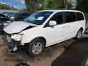 2013 Dodge Grand Caravan SXT with VIN 2C4RDGCG3DR575542, listed as a IAAI auction lot 43406310 with 143,737 mi miles and . Bid and sale history available at DreamBid. Image 2.