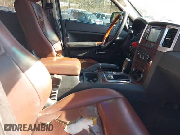 2009 Jeep Grand Cherokee with VIN 1J8HR68T39C540795, listed as a IAAI auction lot 41379112 with 236,624 mi miles and . Bid and sale history available at DreamBid. Image 5.