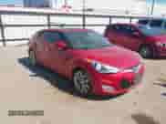 2012 Hyundai Veloster w/Gray Int z VIN KMHTC6AD1CU051606, wystawiony jako IAAI lot #43436964 z przebiegiem 144 149 mil mil oraz . Historia ofert i sprzedaży dostępna na DreamBid. Obrazek 1.