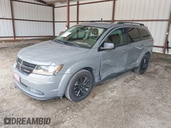 2020 Dodge Journey SE Value with VIN 3C4PDCABXLT259669, listed as a IAAI auction lot 42995598 with 98,957 mi miles and . Bid and sale history available at DreamBid. Image 2.