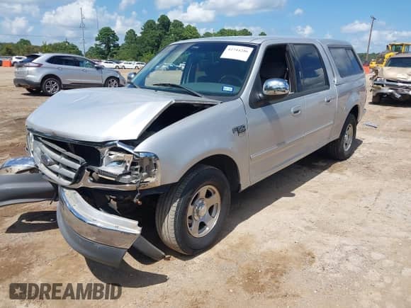 2002 Ford F-150 XLT with VIN 1FTRW07602KB73444, listed as a IAAI auction lot 42744286 with 208,152 mi miles and . Bid and sale history available at DreamBid. Image 2.