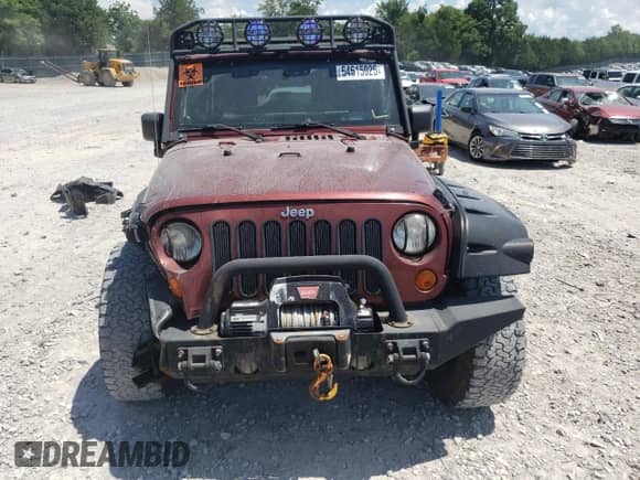 2007 Jeep Wrangler Unlimited Rubicon with VIN 1J4GA69127L155288, listed as a Copart auction lot 64615025 with 176,225 mi miles and Salvage title. Bid and sale history available at DreamBid. Image 5.
