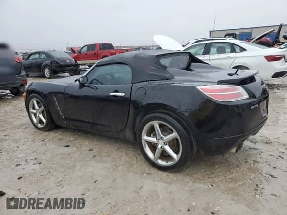2009 Saturn Sky Red Line with VIN 1G8MG35X39Y106052, listed as a Copart auction lot 69893854 with 124,937 mi miles and Salvage title. Bid and sale history available at DreamBid. Image 2.