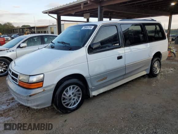 1995 Dodge Caravan with VIN 1B4GH54R1SX617718, listed as a Copart auction lot 79945724 with 107,165 mi miles and Salvage title. Bid and sale history available at DreamBid. Image 1.