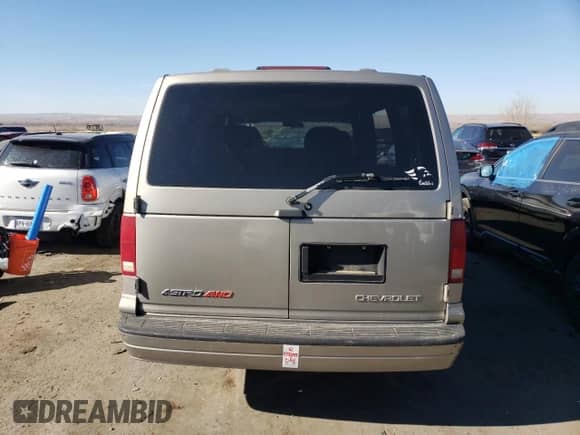 2004 Chevrolet Astro with VIN 1GNEL19X94B128094, listed as a Copart auction lot 82634734 with Not provided miles and Salvage title. Bid and sale history available at DreamBid. Image 6.