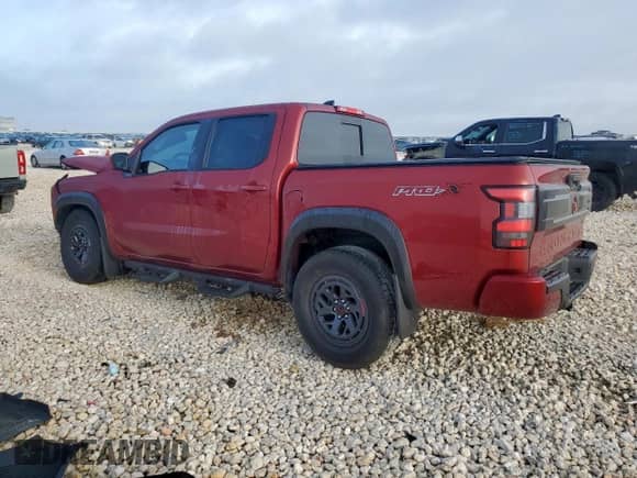 2025 Nissan Frontier Pro-X with VIN 1N6ED1EJXSN637854, listed as a Copart auction lot 65409335 with 2,410 mi miles and Salvage title. Bid and sale history available at DreamBid. Image 2.