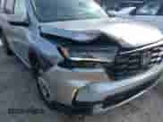 2024 Honda Pilot EX-L with VIN 5FNYG2H59RB010020, listed as a IAAI auction lot 41808244 with 21,400 mi miles and . Bid and sale history available at DreamBid. Image 6.