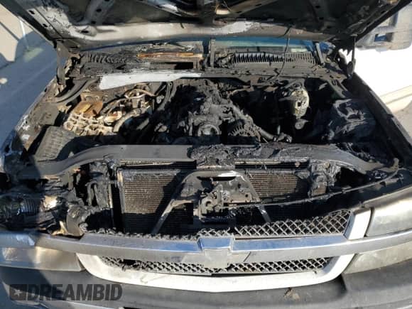 2004 Chevrolet Silverado 2500 LS z VIN 1GCGC23U94F263817, wystawiony jako Copart lot #88172035 z przebiegiem Nie podano mil oraz Szkoda całkowita • Salvage title. Historia ofert i sprzedaży dostępna na DreamBid. Obrazek 11.