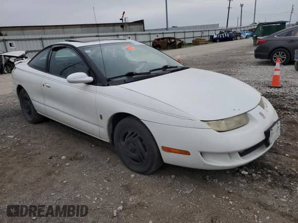 1998 Saturn SC z VIN 1G8ZH1270WZ108164, wystawiony jako Copart lot #65145955 z przebiegiem 169 421 mil mil oraz Szkoda całkowita • Salvage title. Historia ofert i sprzedaży dostępna na DreamBid. Obrazek 4.