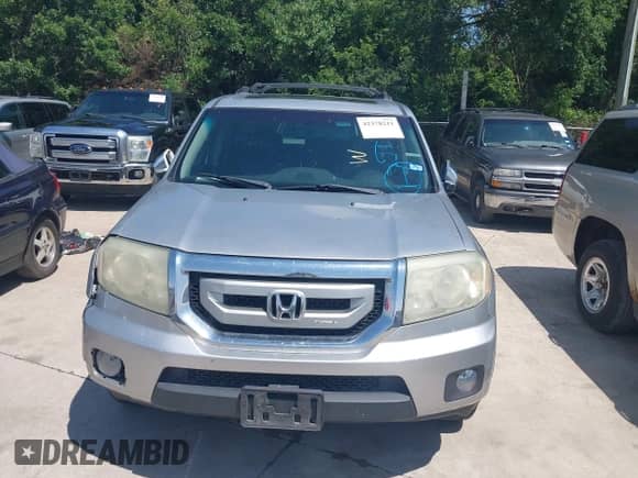 2010 Honda Pilot Touring with VIN 5FNYF3H94AB022723, listed as a IAAI auction lot 42378211 with 326,338 mi miles and . Bid and sale history available at DreamBid. Image 13.