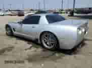 2003 Chevrolet Corvette Z06 z VIN 1G1YY12S935105216, wystawiony jako Copart lot #68721585 z przebiegiem 99 972 mil mil oraz Szkoda całkowita • Salvage title. Historia ofert i sprzedaży dostępna na DreamBid. Obrazek 2.