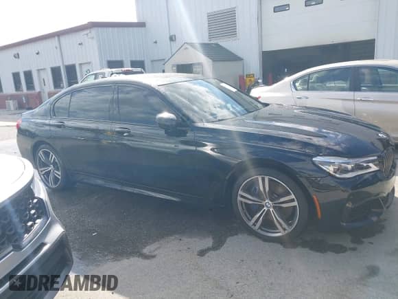 2019 BMW 7 Series 750i xDrive with VIN WBA7F2C51KB239352, listed as a IAAI auction lot 43169276 with 89,821 mi miles and . Bid and sale history available at DreamBid. Image 13.