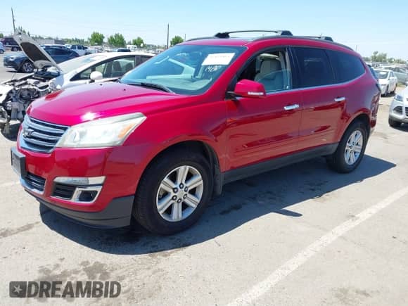 2013 Chevrolet Traverse LT with VIN 1GNKVJKD7DJ199975, listed as a IAAI auction lot 42453404 with 153,127 mi miles and . Bid and sale history available at DreamBid. Image 2.