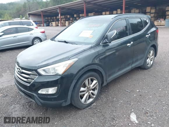 2014 Hyundai Santa Fe with VIN 5XYZU3LA1EG183332, listed as a IAAI auction lot 43307798 with 162,843 mi miles and . Bid and sale history available at DreamBid. Image 2.
