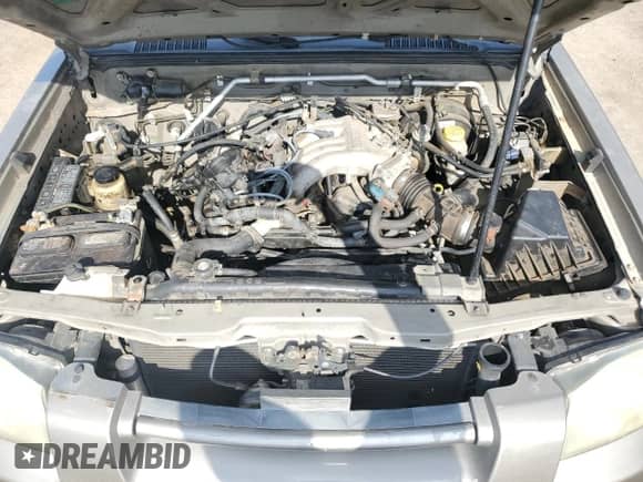 2004 Nissan Frontier XE z VIN 1N6ED27T64C433250, wystawiony jako Copart lot #86091455 z przebiegiem 184 522 mil mil oraz Czysty tytuł • Clean title. Historia ofert i sprzedaży dostępna na DreamBid. Obrazek 11.