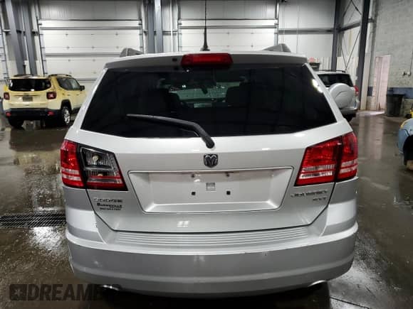 2010 Dodge Journey SXT with VIN 3D4PG5FV6AT190999, listed as a Copart auction lot 69599345 with 127,601 mi miles and Salvage title. Bid and sale history available at DreamBid. Image 6.