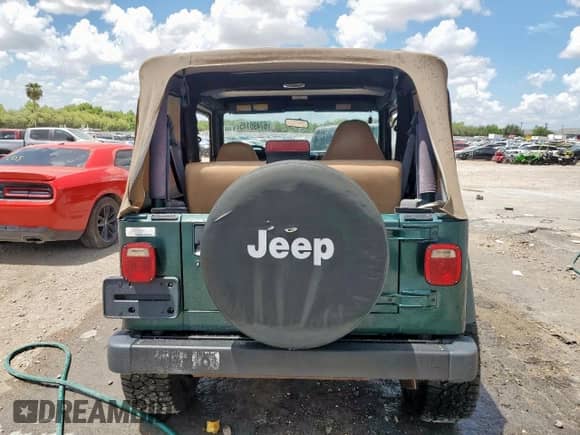 2000 Jeep Wrangler SE with VIN 1J4FA29P2YP800721, listed as a Copart auction lot 67490145 with 128,182 mi miles and Clean title. Bid and sale history available at DreamBid. Image 6.