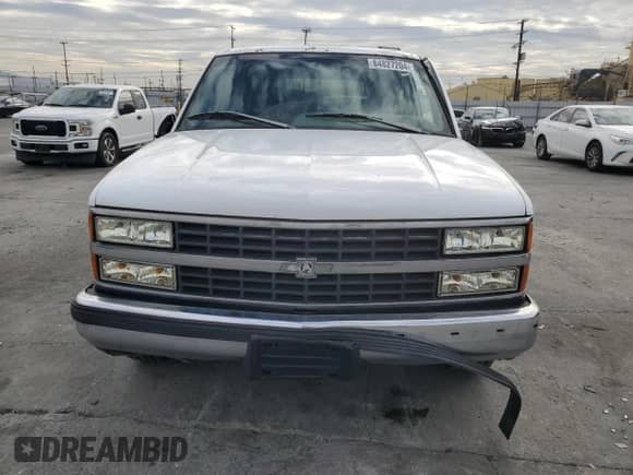 1996 Chevrolet Suburban с VIN 3GNEC16R5TG149147, выставлен на аукционе Copart как лот 84827204 с пробегом 320 305 миль миль и Списание • Salvage title. История ставок и продаж доступна на DreamBid. Изображение 5.