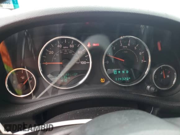 2015 Jeep Wrangler Willys Wheeler z VIN 1C4AJWAG7FL745593, wystawiony jako Copart lot #83771385 z przebiegiem 114 326 mil mil oraz Szkoda całkowita • Salvage title. Historia ofert i sprzedaży dostępna na DreamBid. Obrazek 9.