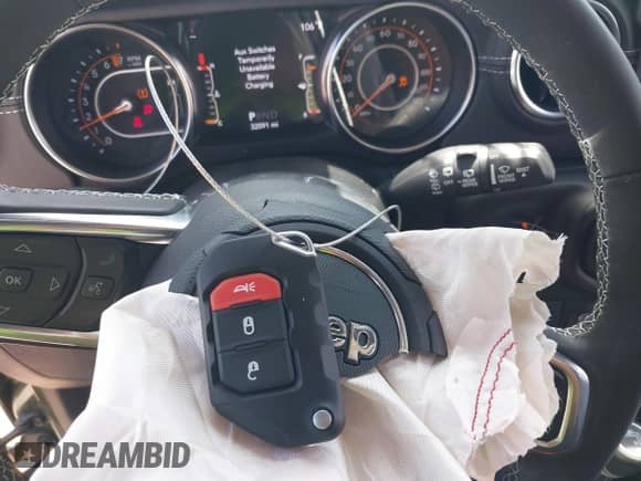 2022 Jeep Wrangler Unlimited Sahara Altitude with VIN 1C4HJXEG3NW194042, listed as a IAAI auction lot 42643314 with 32,091 mi miles and . Bid and sale history available at DreamBid. Image 11.