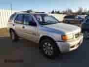 1998 Honda Passport LX with VIN 4S6CM58W0W4404170, listed as a Copart auction lot 83777484 with 181,140 mi miles and Salvage title. Bid and sale history available at DreamBid. Image 4.