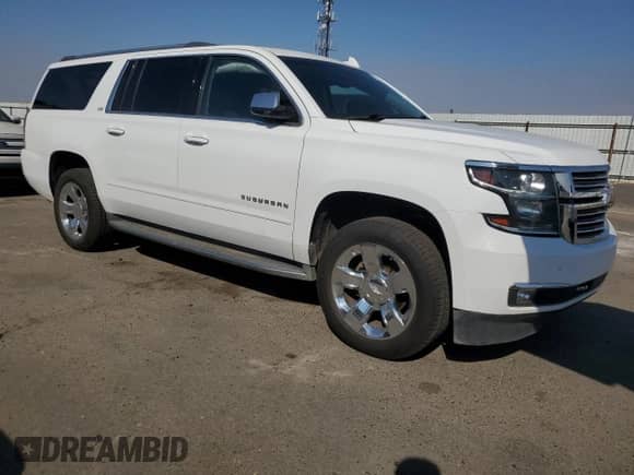2016 Chevrolet Suburban LTZ with VIN 1GNSCJKC7GR415956, listed as a Copart auction lot 71857055 with 213,861 mi miles and Salvage title. Bid and sale history available at DreamBid. Image 4.