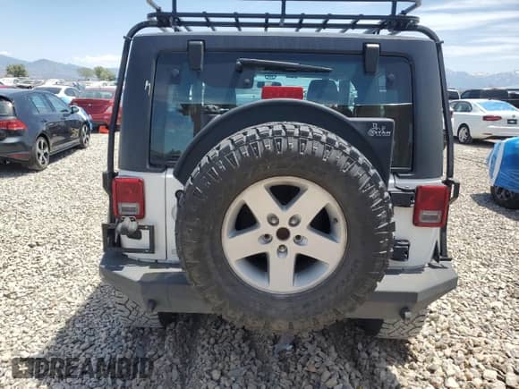 2011 Jeep Wrangler Rubicon with VIN 1J4BA6D12BL535953, listed as a Copart auction lot 59401595 with 77,451 mi miles and Salvage title. Bid and sale history available at DreamBid. Image 6.