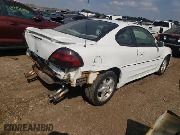 1999 Pontiac Grand Am GT z VIN 1G2NW12E0XM853038, wystawiony jako Copart lot #69262194 z przebiegiem 162 986 mil mil oraz Szkoda całkowita • Salvage title. Historia ofert i sprzedaży dostępna na DreamBid. Obrazek 3.