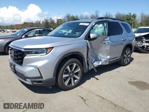 2024 Honda Pilot Touring with VIN 5FNYG1H74RB016366, listed as a Copart auction lot 64484215 with 24,788 mi miles and Salvage title. Bid and sale history available at DreamBid. Image 1.
