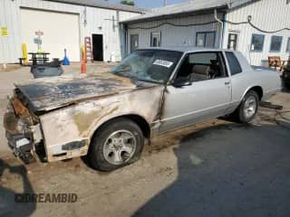 1986 Chevrolet Monte Carlo Sport с VIN 1G1GZ37GXGR161527, выставлен на аукционе Copart как лот 68653895 с пробегом Не указан миль и Списание • Salvage title. История ставок и продаж доступна на DreamBid. Изображение 1.