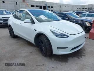 2023 Tesla Model Y Long Range z VIN 7SAYGDEE2PA032311, wystawiony jako IAAI lot #42720695 z przebiegiem 20 640 mil mil oraz . Historia ofert i sprzedaży dostępna na DreamBid. Obrazek 1.