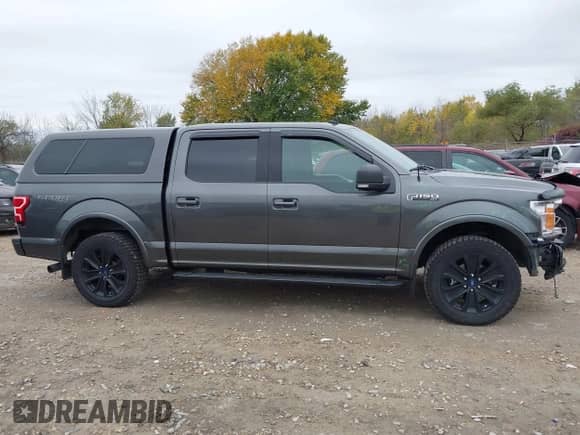 2019 Ford F-150 XLT z VIN 1FTEW1E43KFA09765, wystawiony jako IAAI lot #43442175 z przebiegiem 96 007 mil mil oraz . Historia ofert i sprzedaży dostępna na DreamBid. Obrazek 13.
