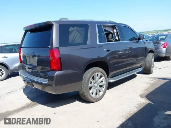 2017 Chevrolet Tahoe Premier with VIN 1GNSKCKC2HR305848, listed as a IAAI auction lot 42809925 with 105,623 mi miles and . Bid and sale history available at DreamBid. Image 4.