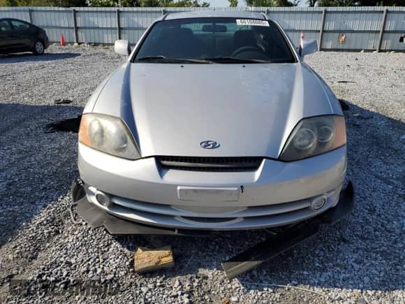 2004 Hyundai Tiburon GT с VIN KMHHN65F94U153507, выставлен на аукционе Copart как лот 66108085 с пробегом 113 413 миль миль и Списание • Salvage title. История ставок и продаж доступна на DreamBid. Изображение 5.