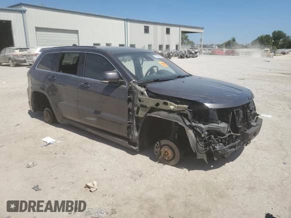 2015 Jeep Grand Cherokee High Altitude z VIN 1C4RJFCT3FC211410, wystawiony jako Copart lot #70558365 z przebiegiem 140 000 mil mil oraz Szkoda całkowita • Salvage title. Historia ofert i sprzedaży dostępna na DreamBid. Obrazek 4.