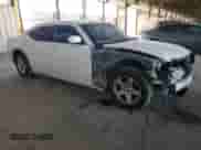 2010 Dodge Charger SXT with VIN 2B3CA3CV0AH290595, listed as a Copart auction lot 73893904 with 127,733 mi miles and Salvage title. Bid and sale history available at DreamBid. Image 4.