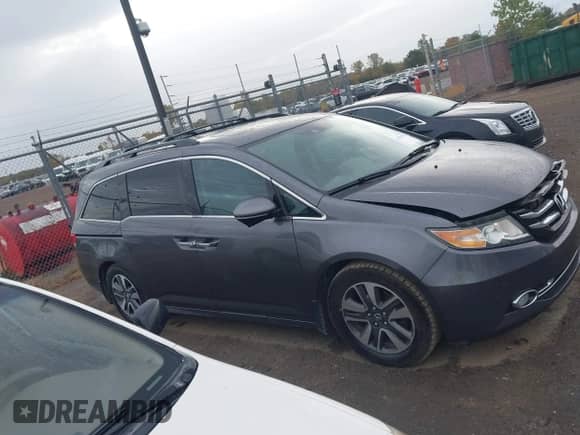 2016 Honda Odyssey Touring Elite z VIN 5FNRL5H92GB052661, wystawiony jako IAAI lot #43451962 z przebiegiem 145 569 mil mil oraz . Historia ofert i sprzedaży dostępna na DreamBid. Obrazek 13.