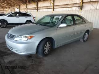 2003 Toyota Camry LE with VIN JTDBE32K330184641, listed as a Copart auction lot 86717825 with 110,616 mi miles and Salvage title. Bid and sale history available at DreamBid. Image 1.